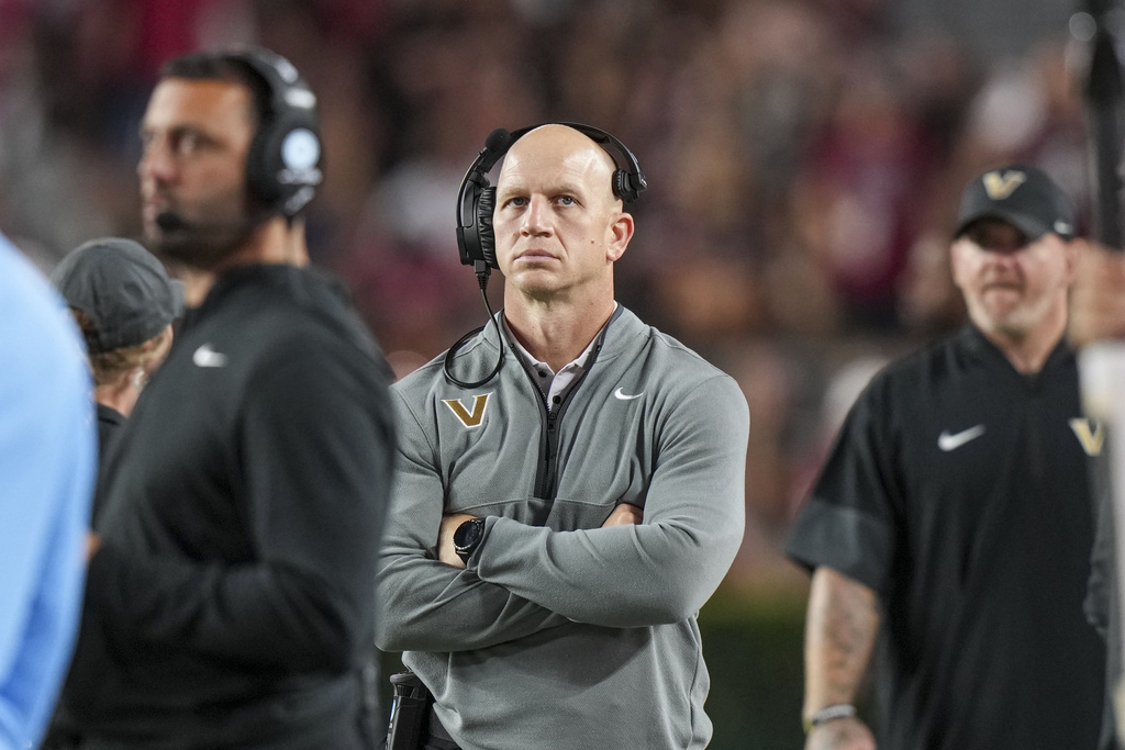 Vanderbilt head coach Clark Lea, center, watches the action from the sideline in the second half of an NCAA college football game against South Carolina, Saturday, Sept. 13, 2025, in Columbia, S.C. (AP Photo/David Yeazell)