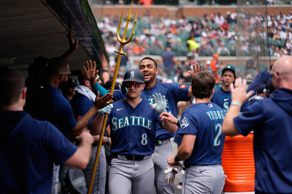 Seattle Mariners' Dominic Canzone (8) celebrates his home run against the Detroit Tigers during the third inning of a baseball game Saturday, June 6, 2026, in Detroit. (AP Photo/Paul Sancya)