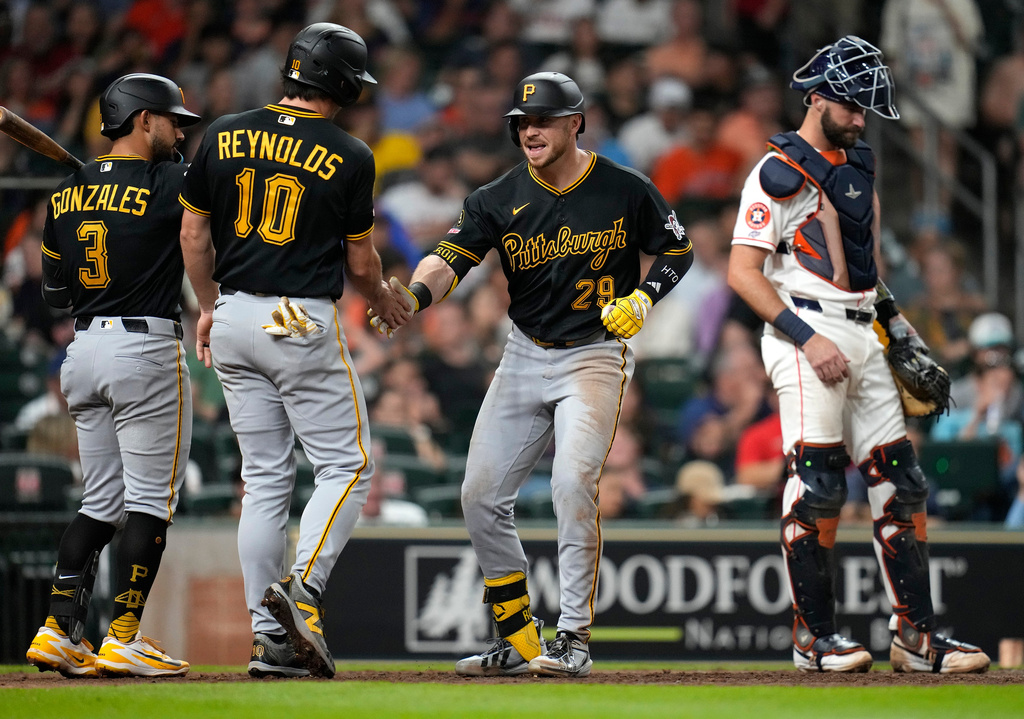 Pittsburgh Pirates' Ryan O'Hearn (29) celebrates his two-run home run with Bryan Reynolds (10) and Nick Gonzales (3) during the sixth inning of a baseball game against the Houston Astros, Thursday, June 4, 2026, in Houston. (AP Photo/Karen Warren)