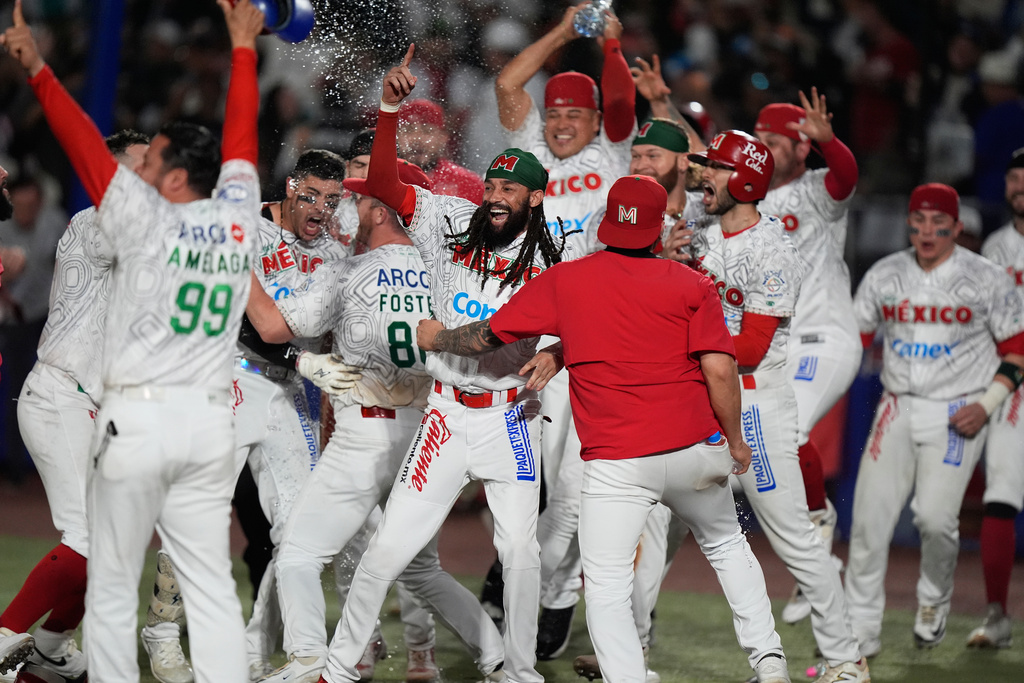 Mexico Red players celebrate after beating Mexico Green during the Caribbean Series baseball championship game in Guadalajara, Mexico, Saturday, Feb. 7, 2026. (AP Photo/Fernando Llano)