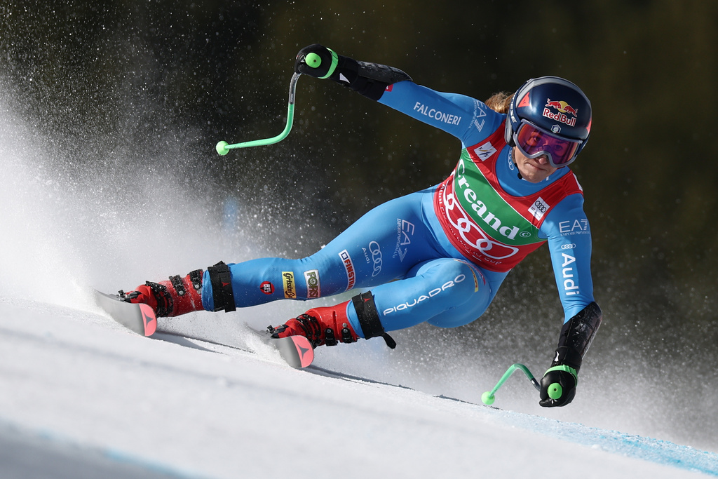 Italy's Sofia Goggia speeds down the course during a women's World Cup super-G race, in Soldeu, Andorra, Sunday, March 1, 2026. (AP Photo/Gabriele Facciotti)