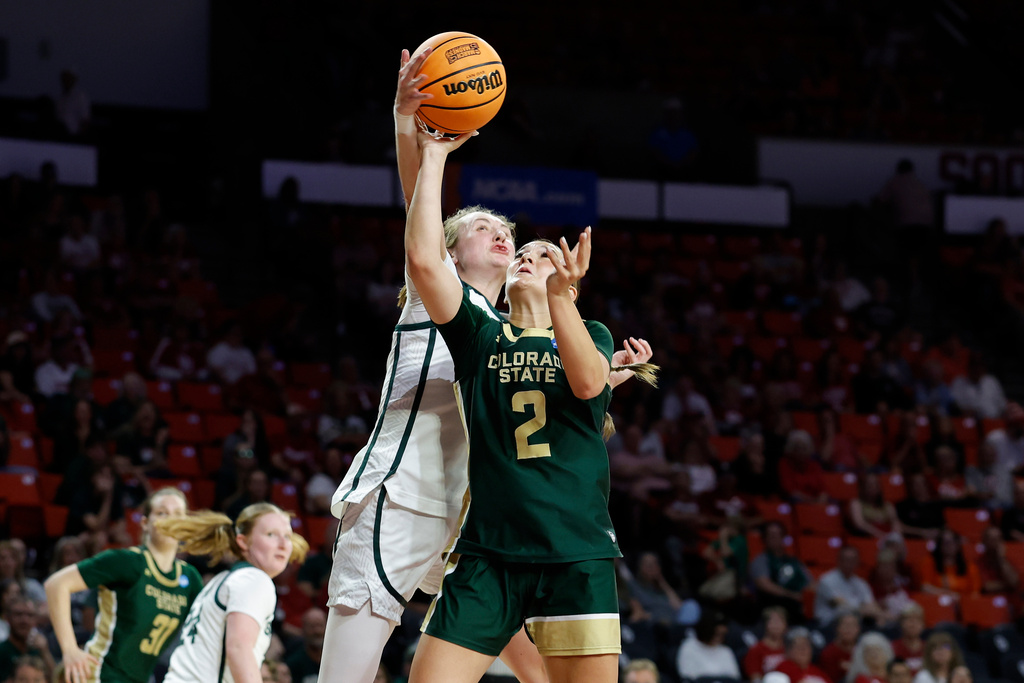 Michigan State guard Kennedy Blair (35) blocks a shot by Colorado State guard Brooke Carlson (2) during the second half in the first round of the NCAA college basketball tournament Friday, March 20, 2026, Norman, Okla. (AP Photo/Alonzo Adams)