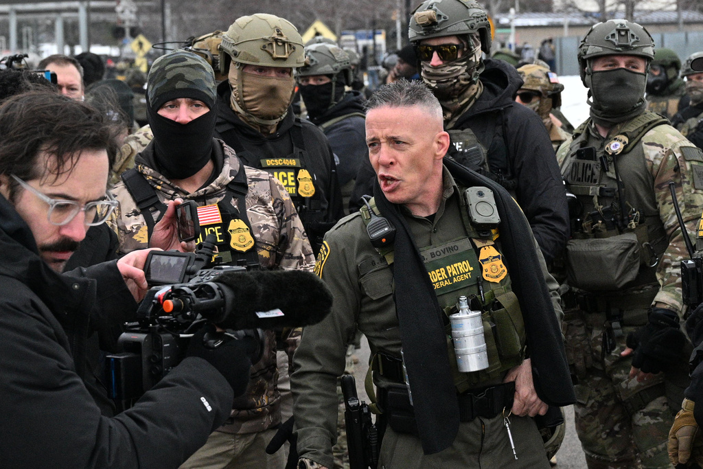 U.S. Border Patrol Cmdr. Gregory Bovino arrives as protesters gather outside the Bishop Henry Whipple Federal Building, Thursday, Jan. 8, 2026, in Minneapolis, Minn. (AP Photo/Tom Baker)