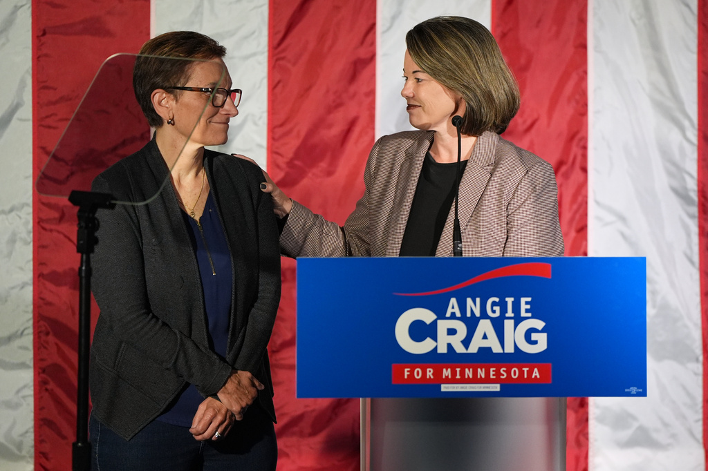 U.S. Rep. Angie Craig, D-Minn., right, candidate for U.S Senate, stands on stage next to her wife Cheryl Greene during an election night event on Tuesday, Aug. 11, 2026, in St. Paul, Minn. (AP Photo/Abbie Parr)