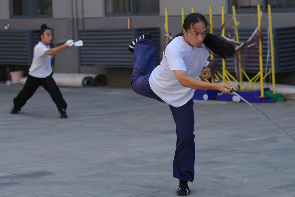 Students practice at the Wudang Taoist Traditional Kung Fu Academy near Wudang Mountain in Shiyan city in central China's Hubei province on Friday, Sept. 4, 2026. (AP Photo/Achmad Ibrahim)
