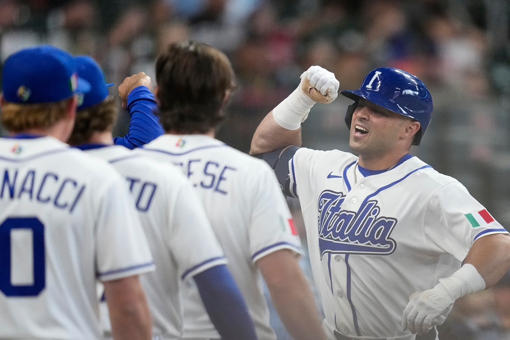 Italy's Dante Nori, right, celebrates after hitting a home run against Brazil during the seventh inning of a World Baseball Classic game, Saturday, March 7, 2026, in Houston. (AP Photo/David J. Phillip)