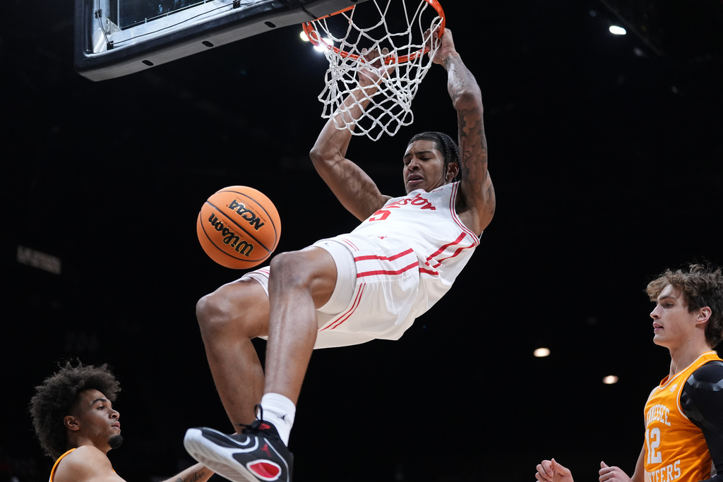 Houston center Chris Cenac Jr. (5) scores over Tennessee guard Ja'Kobi Gillespie (0) and forward Cade Phillips (12) during the first half of an NCAA college basketball game in the Players Era tournament Las Vegas, Tuesday, Nov. 25, 2025. (AP Photo/Eric Gay)