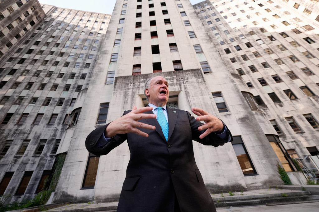Tulane University president Michael A. Fitts talks outside the old Charity Hospital building Wednesday, Aug. 19, 2026, in New Orleans. (AP Photo/Gerald Herbert)