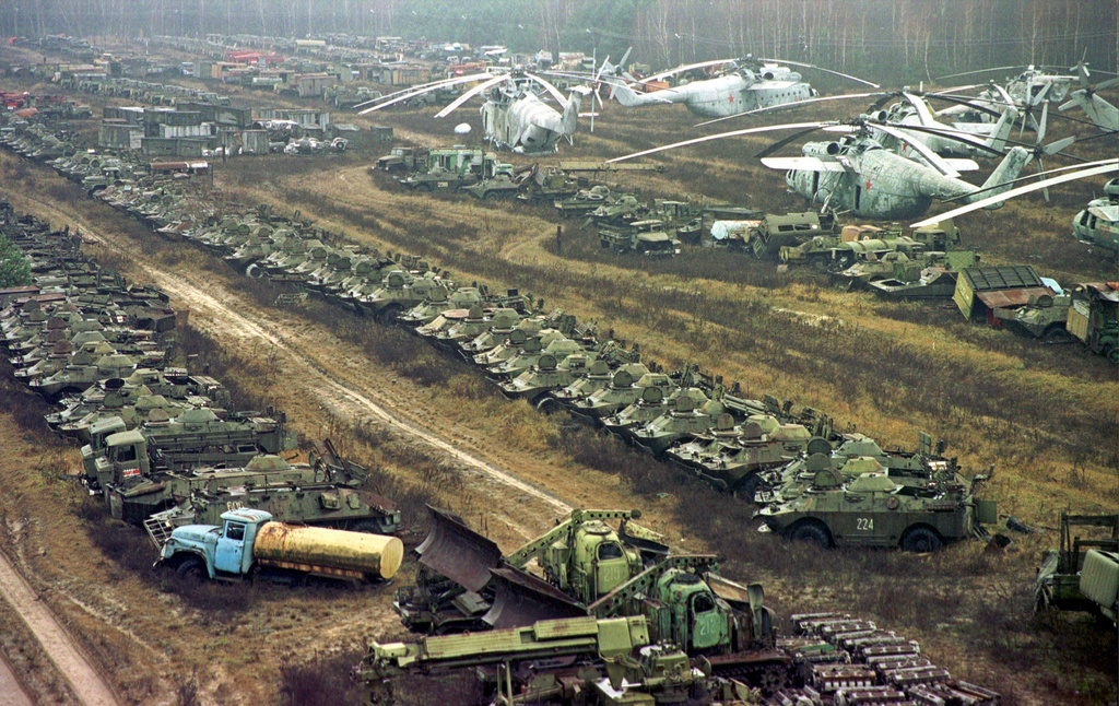 FILE - About 1,350 Soviet military helicopters, buses, bulldozers, tankers, transporters, fire engines and ambulances, all highly contaminated with radiation, sit abandoned in a junkyard, in Chernobyl, Ukraine, Nov. 10, 2000, after being used in cleanup operations following the 1986 explosion in the Chernobyl nuclear power plant. (AP Photo/Efrem Lukatsky, File )