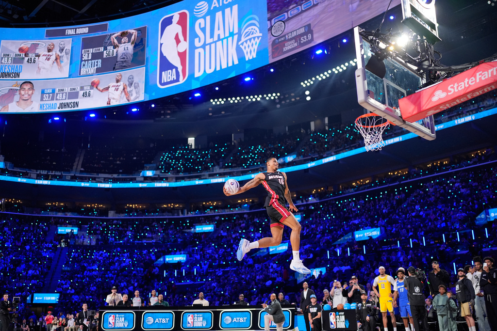 Miami Heat forward Keshad Johnson dunks during the slam dunk contest at the NBA basketball All-Star weekend festivities Saturday, Feb. 14, 2026, in Inglewood, Calif. (AP Photo/Mark J. Terrill)