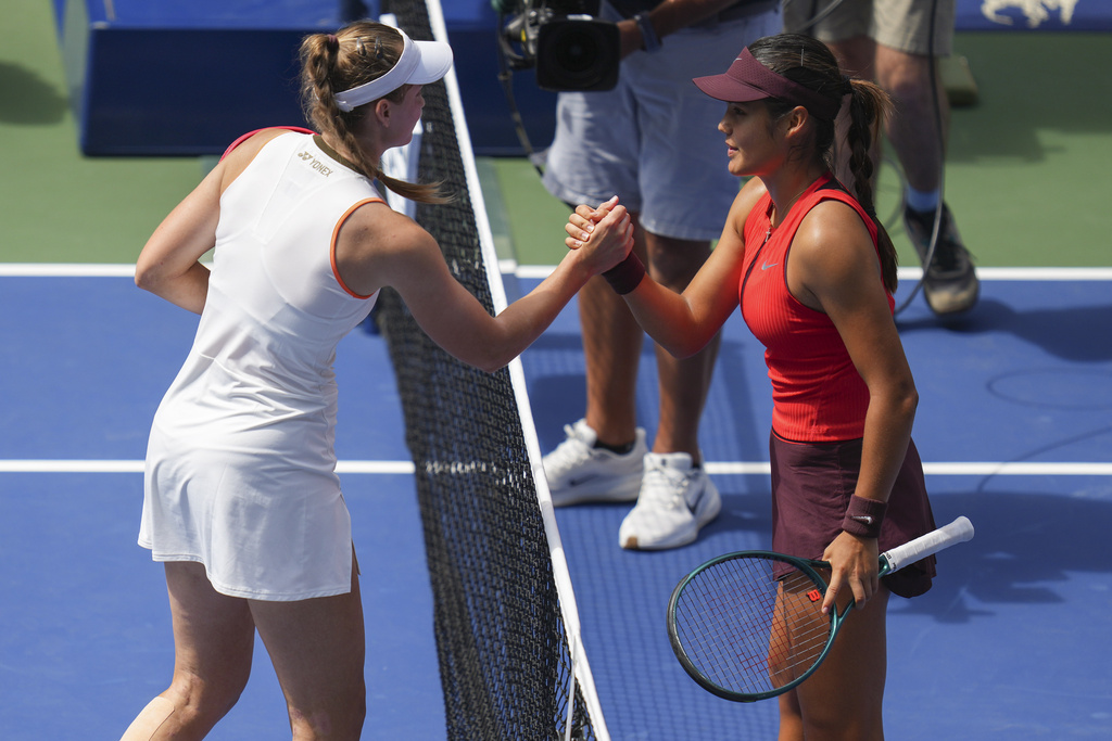 Elena Rybakina, of Kazakhstan, shakes hands with Emma Raducanu, of Great Britain, after winning their third-round match of the U.S. Open tennis championships, Friday, Aug. 29, 2025, in New York. (AP Photo/Kirsty Wigglesworth)