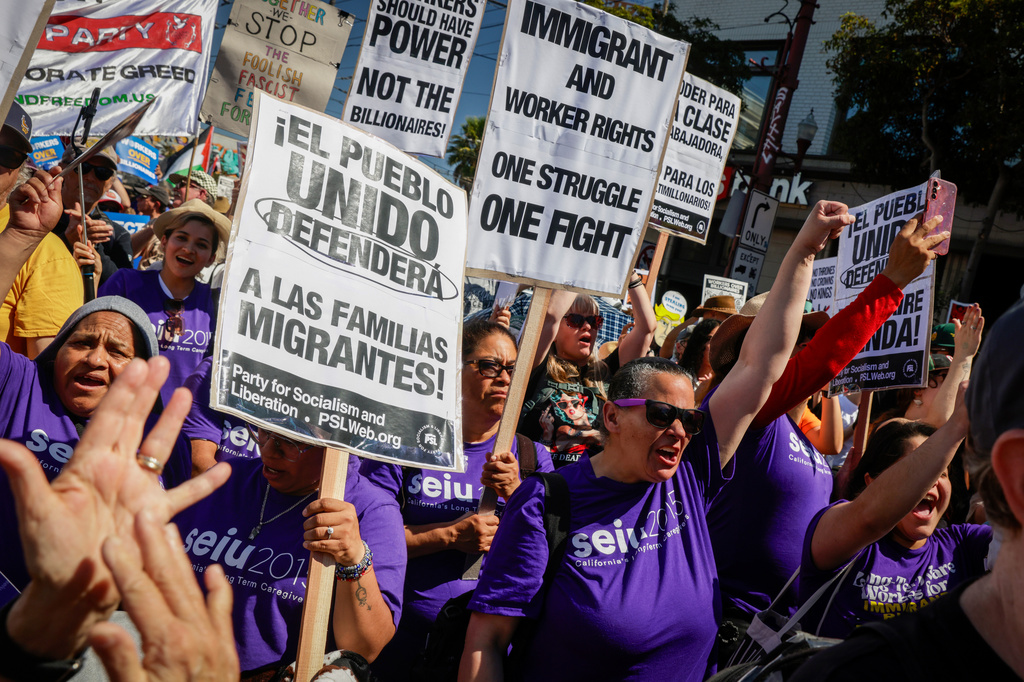 FILE - Raven Winchell, of Seui 2015 Long Term Care Givers, raises her fist during a rally advocating for workers and protesting against President Donald Trump's administration in the Mission District in San Francisco, Calif., Sept. 1, 2025. (Bronte Wittpenn/San Francisco Chronicle via AP, File)