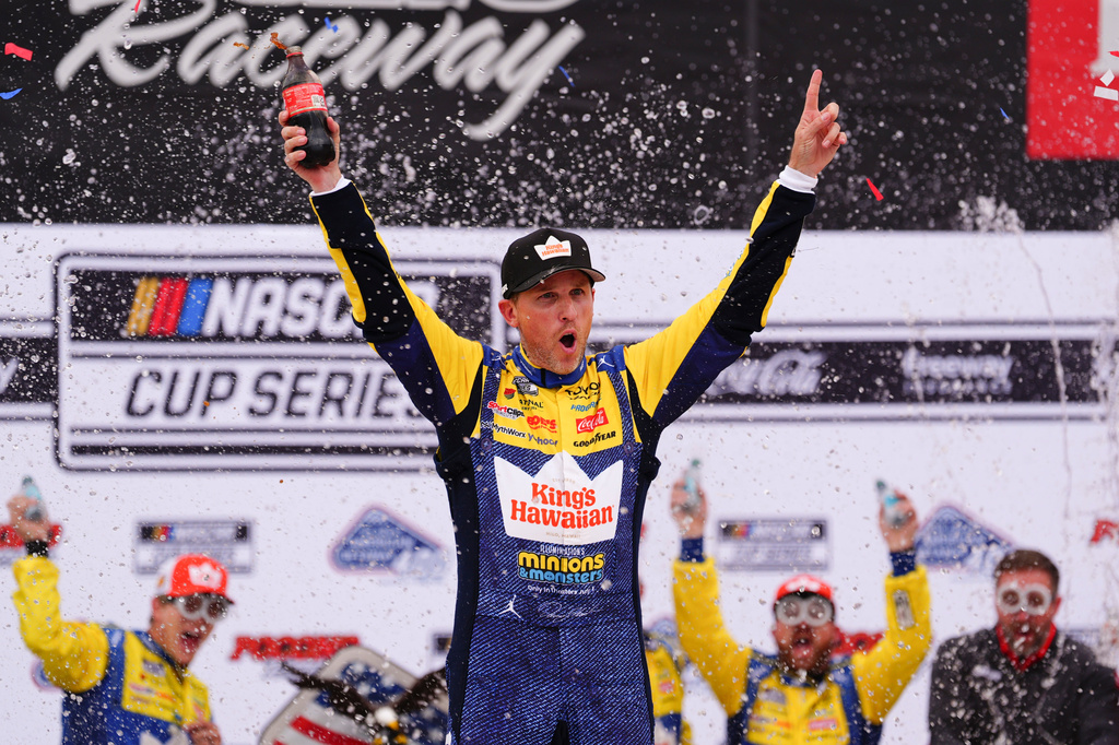 Denny Hamlin celebrates in Victory Lane after winning a NASCAR Cup Series auto race at Pocono Raceway, Sunday, June 14, 2026, in Long Pond, Pa. (AP Photo/Derik Hamilton)