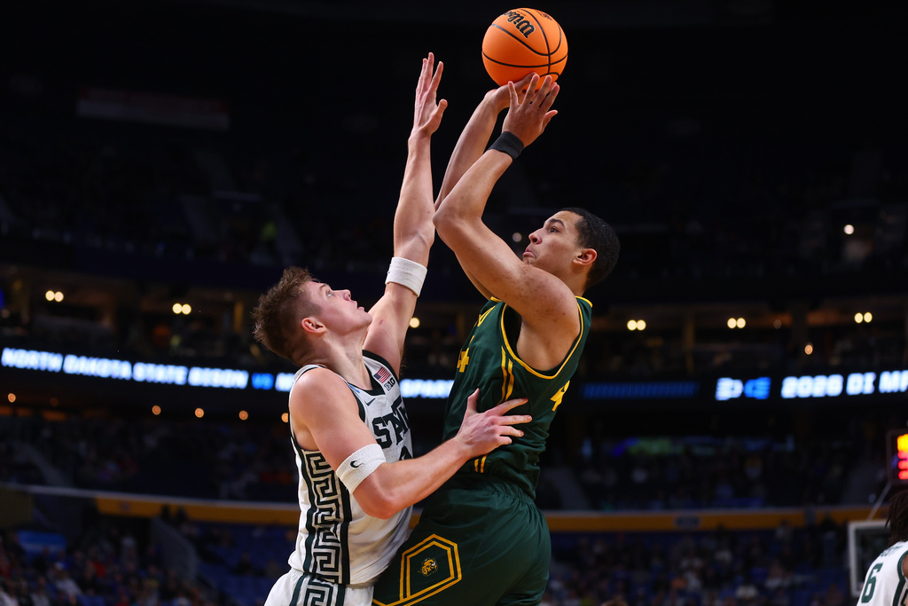North Dakota State forward Treyson Anderson (44) shoots over Michigan State forward Jaxon Kohler (0) during the second half in the first round of the NCAA college basketball tournament, Thursday, March 19, 2026, in Buffalo, N.Y. (AP Photo/Jeffrey T. Barnes)