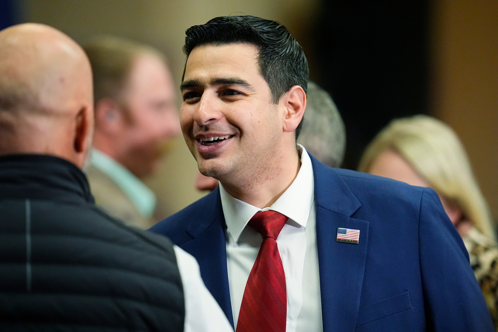 FILE - Colorado Rep. Gabe Evans talks to well-wishers before the first Republican primary debate for the state's 8th Congressional district seat, Jan. 25, 2024, in Fort Lupton, Colo. (AP Photo/David Zalubowski, File)