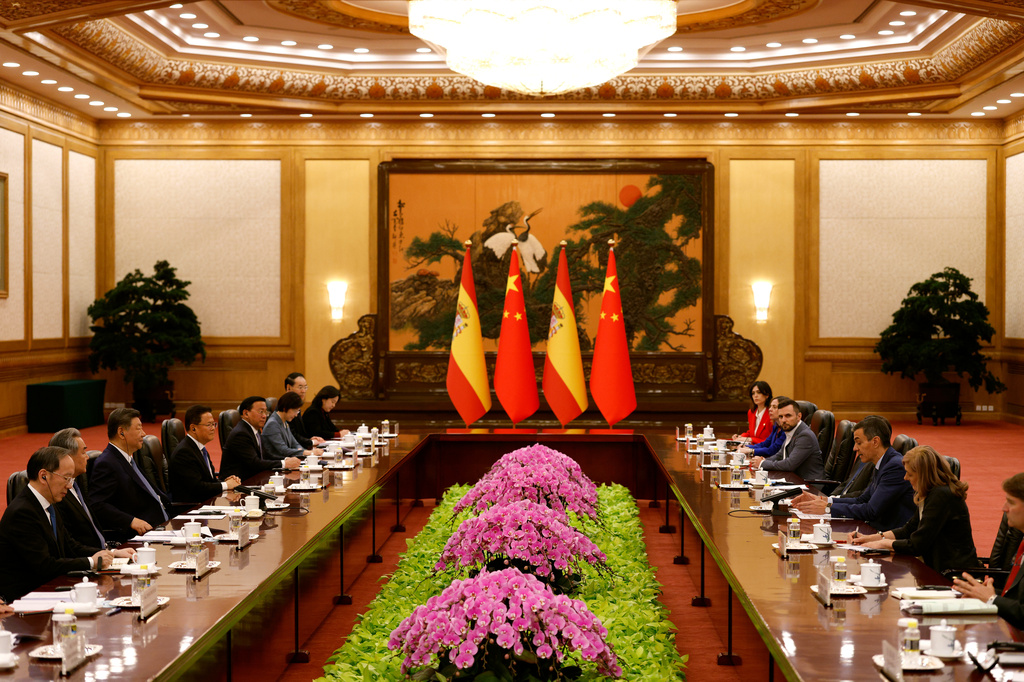 China's President Xi Jinping, third left, and Spain's Prime Minister Pedro Sanchez, third right, attend a meeting at the Great Hall of the People in Beijing Tuesday, April 14, 2026. (Haruna Furuhashi/Pool Photo via AP)