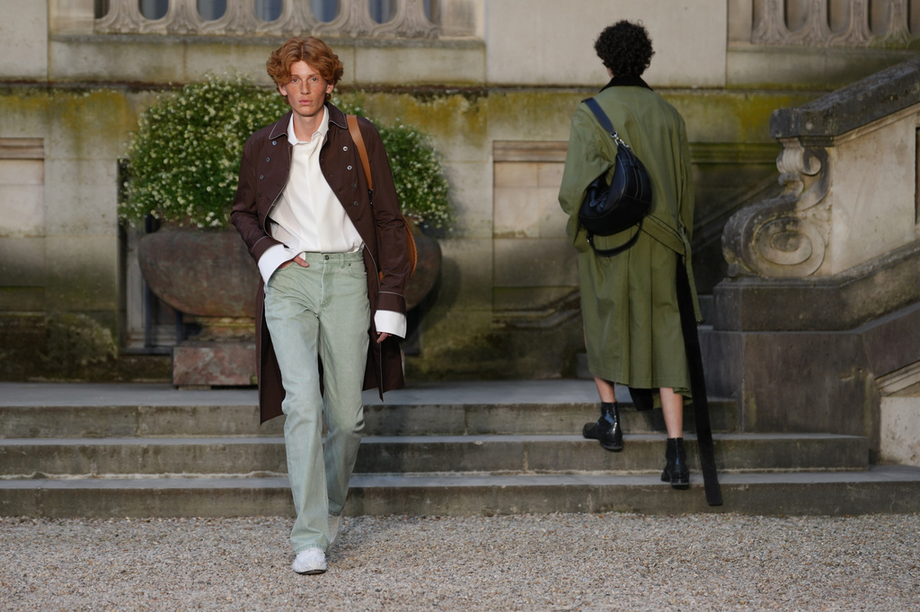 Models wear creations as part of the Dior Homme Spring Summer 2027 collection presented in Paris, France, Wednesday, June 24, 2026. (AP Photo/Aurelien Morissard)