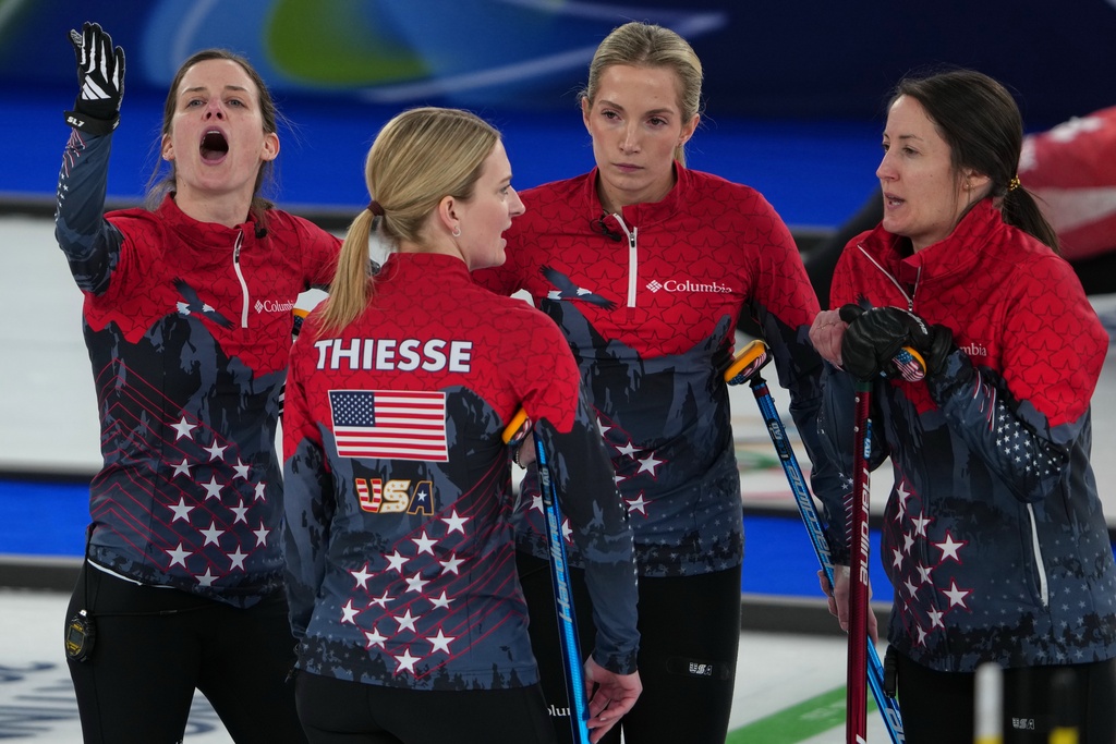 United States' Cory Thiesse, Taylor Anderson-Heide, Tabitha Peterson, and Tara Peterson in action during the women's curling round robin session against Canada, at the 2026 Winter Olympics, in Cortina d'Ampezzo, Italy, Friday, Feb. 13, 2026. (AP Photo/Misper Apawu)