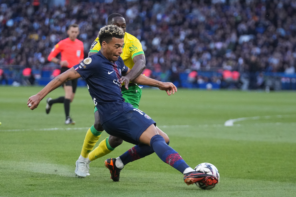 PSG's Desire Doue controls the ball during the French League One soccer match between Paris Saint-Germain and Nantes in Paris, France, Wednesday, April 22, 2026. (AP Photo/Michel Euler)