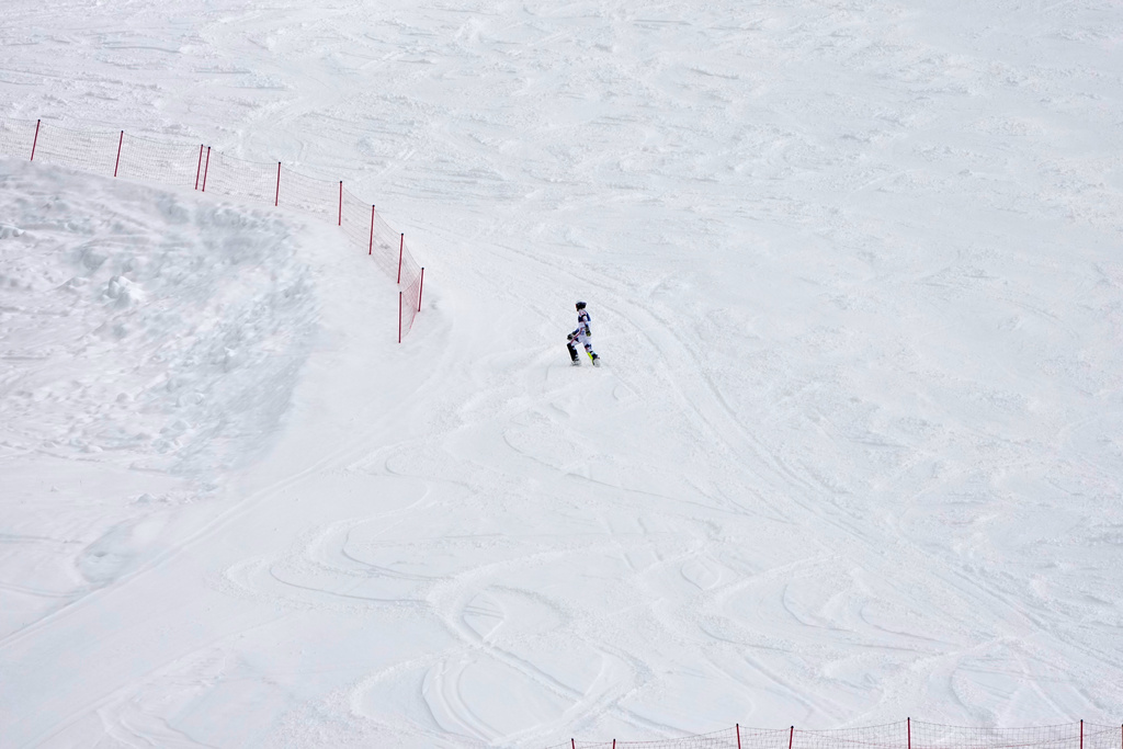 Norway's Atle Lie McGrath walks off the course after skiing out during an alpine ski, men's slalom race, at the 2026 Winter Olympics, in Bormio, Italy, Monday, Feb. 16, 2026. (AP Photo/John Locher)