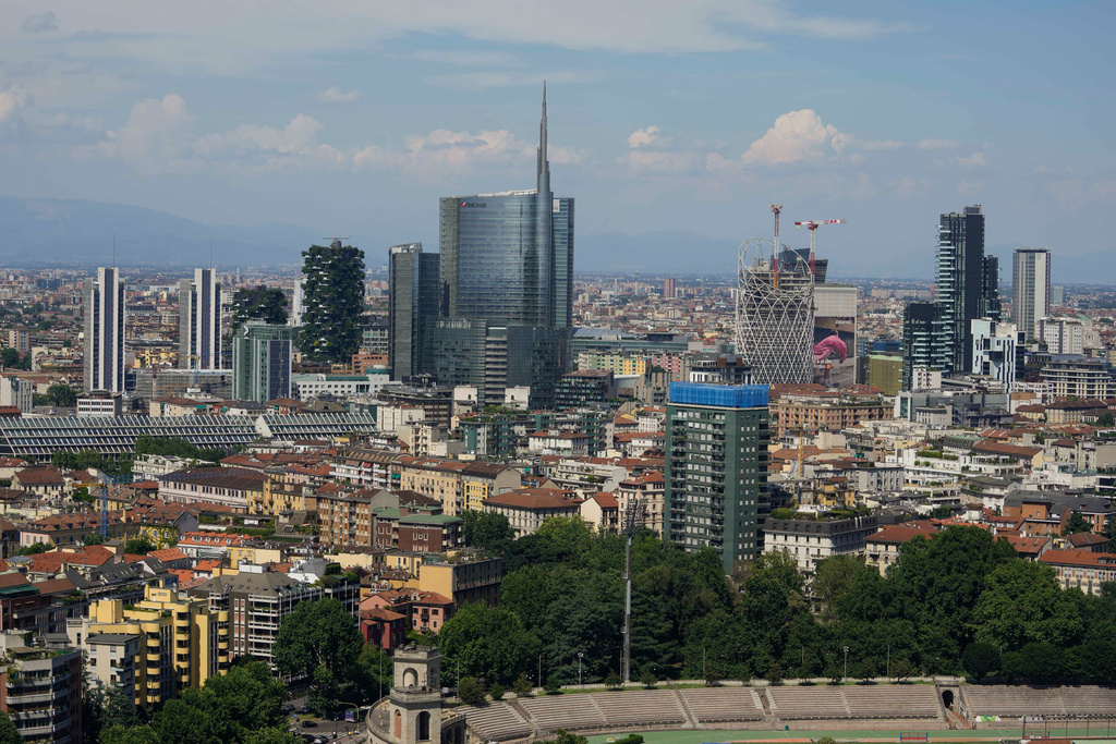 FILE — This photo shows Milan's CityLife district, including the city's tallest buildings, towering over housing architecture on June 26, 2021. (AP Photo/Luca Bruno, File)