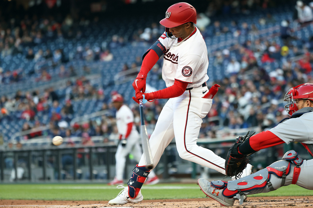 Washington Nationals' Daylen Lile hits an RBI single during the first inning of a baseball game against the St. Louis Cardinals, Tuesday, April 7, 2026, in Washington. (AP Photo/Daniel Kucin Jr.)
