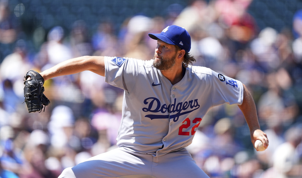 Los Angeles Dodgers starting pitcher Clayton Kershaw works against the Colorado Rockies in the first inning of a baseball game Thursday, Aug. 21, 2025, in Denver. (AP Photo/David Zalubowski)