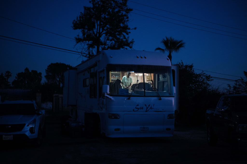 Ellaird Bailey and his wife Charlotte live inside their RV parked on their property, Thursday, Dec. 11, 2025, in Altadena, Calif., after their home was burned by the Eaton Fire. (AP Photo/Jae C. Hong)