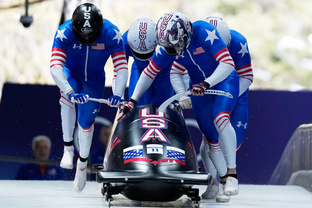 United States' Kristopher Horn, front, Caleb Furnell, Hunter Powell and Carsten Vissering start for a four man bobsled run at the 2026 Winter Olympics, in Cortina d'Ampezzo, Italy, Saturday, Feb. 21, 2026. (AP Photo/Alessandra Tarantino)