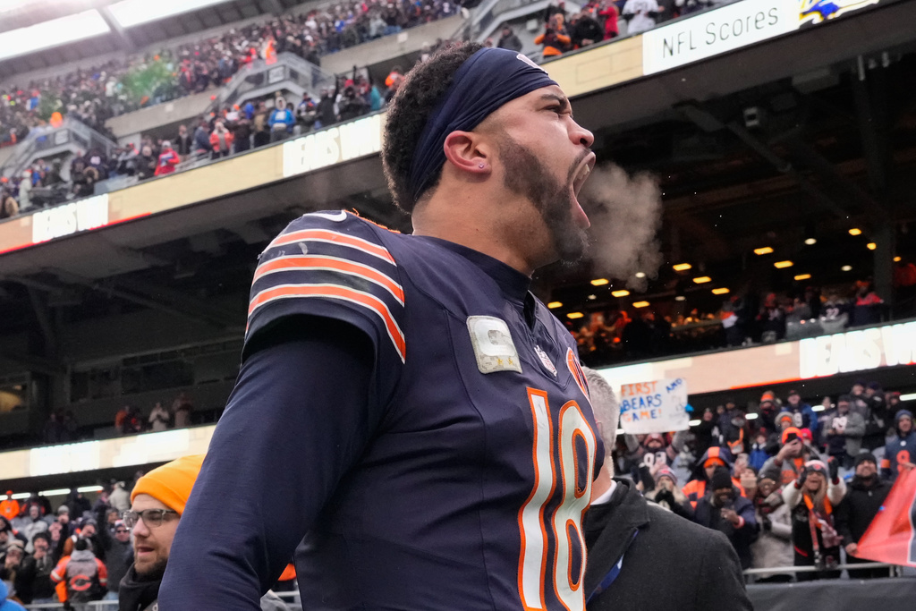 Chicago Bears quarterback Caleb Williams celebrates as he leaves the field after an NFL football game against the New York Giants, Sunday, Nov. 9, 2025, in Chicago. (AP Photo/Nam Y. Huh)