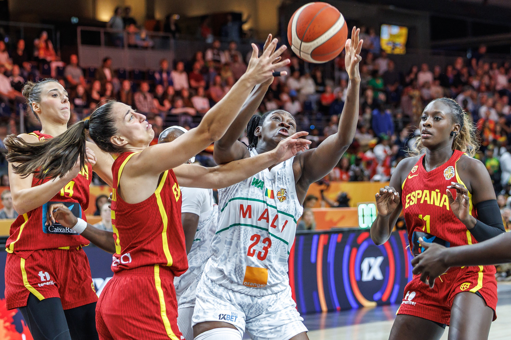 Mali's Sika Kone vies for the ball with Spain's Maite Cazorla, left, during the women's World Cup basketball match between Mali and Spain, in Berlin, Saturday, Sept. 5, 2026. (Andreas Gora/dpa via AP)