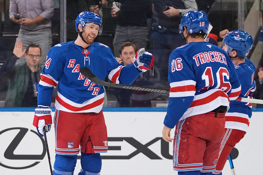 New York Rangers' Vladislav Gavrikov celebrates with teammates after scoring a goal during the first period of an NHL hockey game against the Nashville Predators Monday, Nov. 10, 2025, in New York. (AP Photo/Frank Franklin II)