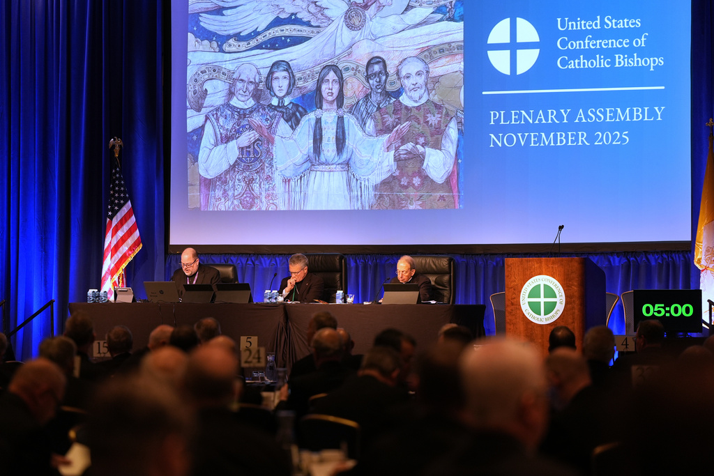 From left; Rev. Michael J.K. Fuller, Archbishop Timothy Broglio and Archbishop William Lori of Baltimore conduct the United States Conference of Catholic Bishops plenary assembly in Baltimore, Tuesday, Nov. 11, 2025. (AP Photo/Stephanie Scarbrough)