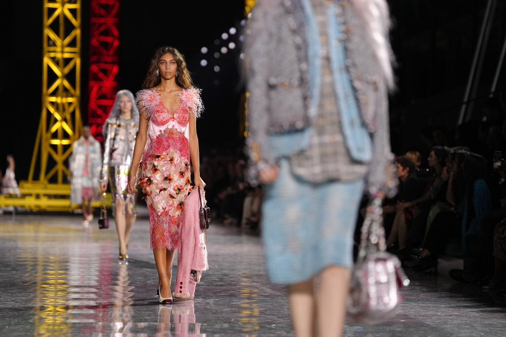 A model wears a creation as part of the Chanel Fall/Winter 2026-2027 Women's collection presented in Paris, Monday, March 9, 2026. (AP Photo/Aurelien Morissard)