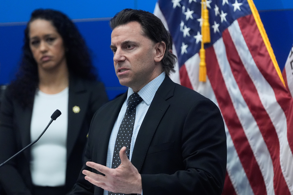 Matt Cobo, F.B.I. San Francisco Acting Special Agent in Charge, right, speaks next to San Francisco District Attorney Brooke Jenkins during a news conference Monday, April 13, 2026, in San Francisco. (AP Photo/Jeff Chiu)