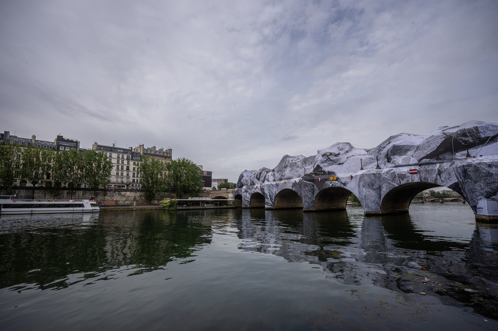 Artwork "The Pont Neuf Cave" by French street artist JR on the Pont Neuf bridge opens to the public from June 15 to 28, in Paris, Tuesday, June 16, 2026, in Paris. (AP Photo/Aurelien Morissard)