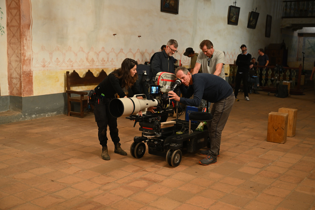 This image released by Warner Bros. Pictures shows camera/steadicam operator Colin Anderson filming a scene from "One Battle After Another." (Michael Bauman/Warner Bros. Pictures via AP)