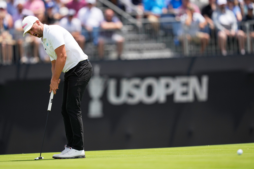 Wyndham Clark reacts after missing a putt on the 13th hole during the second round of the U.S. Open golf tournament at Shinnecock Hills Golf Club in Southampton, N.Y., Friday, June 19, 2026.(AP Photo/David J. Phillip)