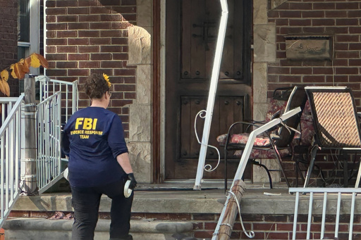 An FBI agent enters a home in a Dearborn, Mich., neighborhood on Friday, Oct. 31, 2025. (AP Photo/Mike Householder) An FBI agent enters a home in a Dearborn, Mich., neighborhood on Friday, Oct. 31, 2025. (AP Photo/Mike Householder)