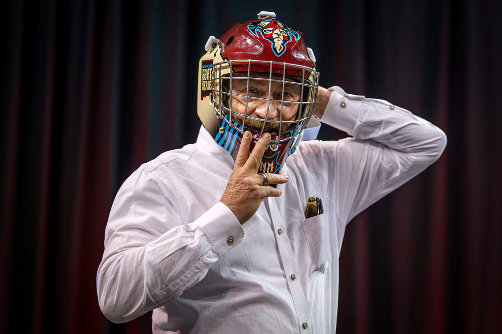 Mayor Gregg Hull puts on a New Mexico Goatheads' helmet at the Rio Rancho Events Center in Rio Rancho, N.M., on Sept. 29, 2025. (Jessica Baca/The Albuquerque Journal via AP)