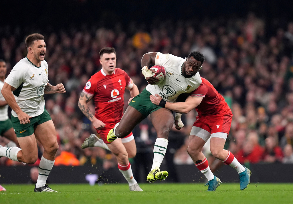 South Africa's Siya Kolisi is tackled by Wales's Blair Murray during the rugby union international match between Wales and South Africa in Cardiff, Wales, Saturday Nov. 29, 2025. (Andrew Matthews/PA via AP)