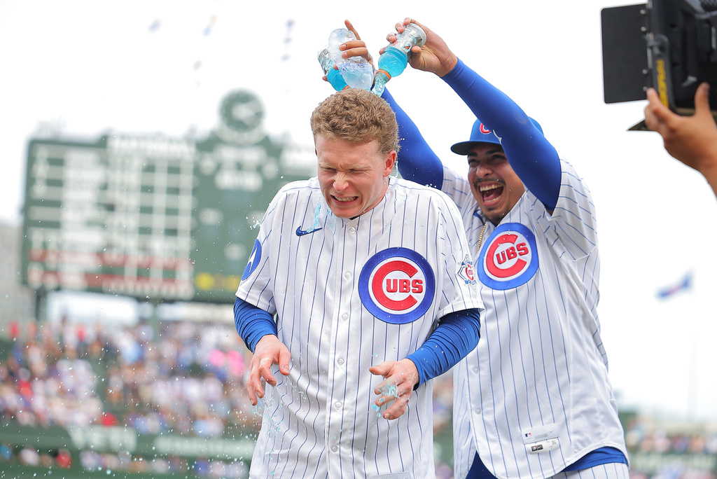 Chicago Cubs' Daniel Palencia dumps Gatorade on Pete Crow-Armstrong after a baseball game against the Cincinnati Reds, Saturday, Aug. 29, 2026, in Chicago. (AP Photo/Melissa Tamez)