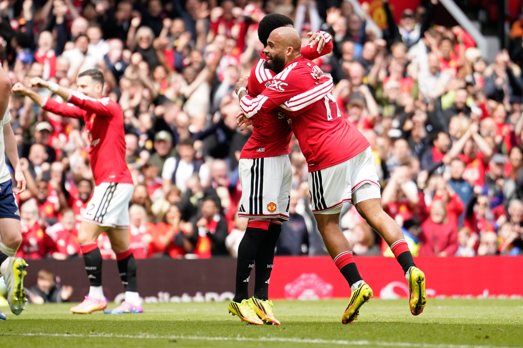 Manchester United's Bryan Mbeumo, right, celebrates after scoring his side's third goal during the English Premier League soccer match between Manchester United and Nottingham Forest in Manchester, England, Sunday, May 17, 2026. (AP Photo/Dave Thompson)