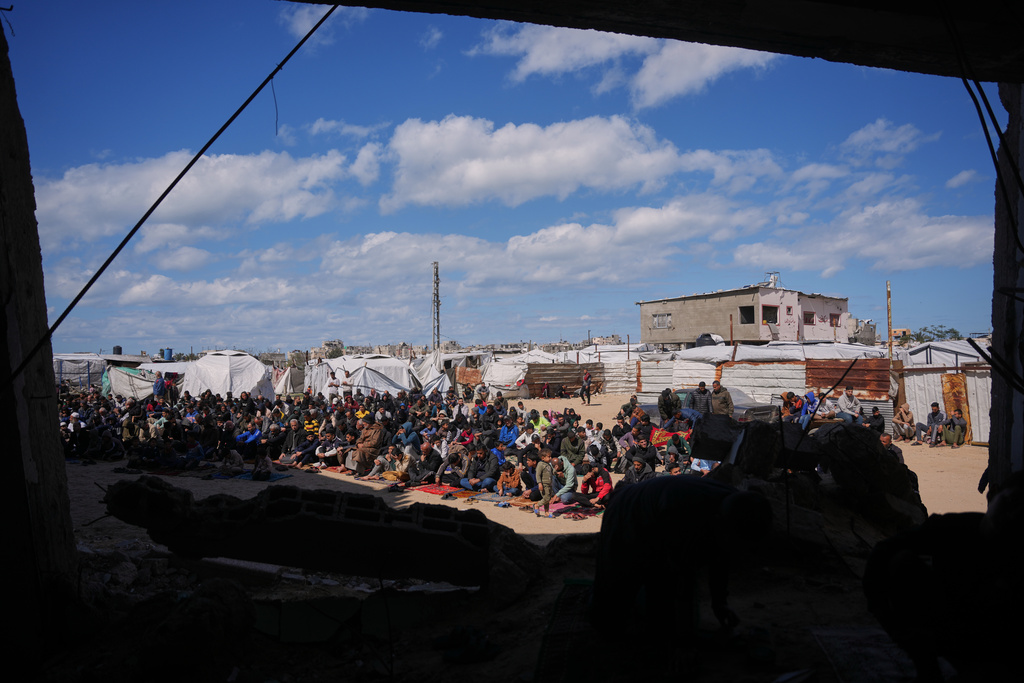 Muslim worshippers take part in the Friday prayers during the holy month of Ramadan outside the destroyed Al-Albani Mosque, in Khan Younis, southern Gaza Strip, Friday, Feb. 27, 2026. (AP Photo/Abdel Kareem Hana)