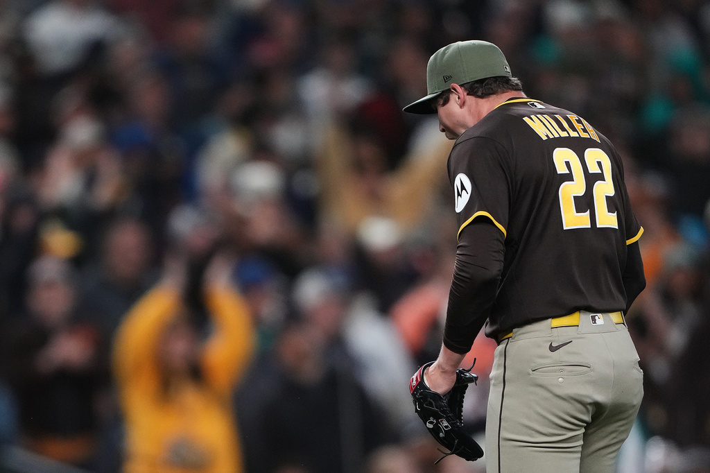 San Diego Padres relief pitcher Mason Miller react to getting the final out of the eighth inning of a baseball game against the Seattle Mariners, Friday, May 15, 2026, in Seattle. (AP Photo/Lindsey Wasson)