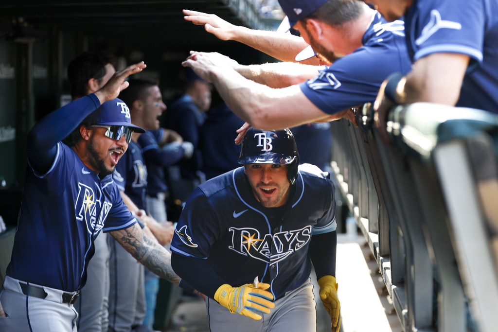 Tampa Bay Rays pinch hitter Nick Fortes celebrates with teammates in the dugout after hitting a solo home run against the Chicago Cubs during the ninth inning of a baseball game Saturday, Sept. 13, 2025, in Chicago. (AP Photo/Kamil Krzaczynski)