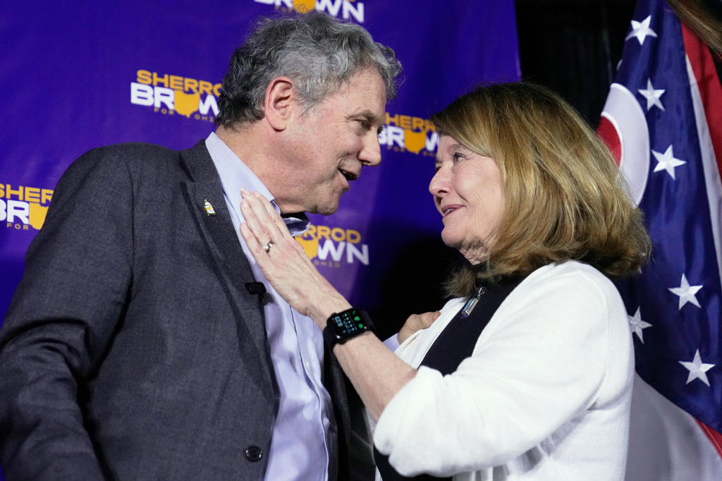 Democratic Ohio Senate candidate Sherrod Brown, a former three-term U.S. senator, left, and wife Connie Shultz react on stage at a primary election night campaign event after Brown won the party's primary for US Senate in Cleveland, Tuesday, May 5, 2026. (AP Photo/Sue Ogrocki)