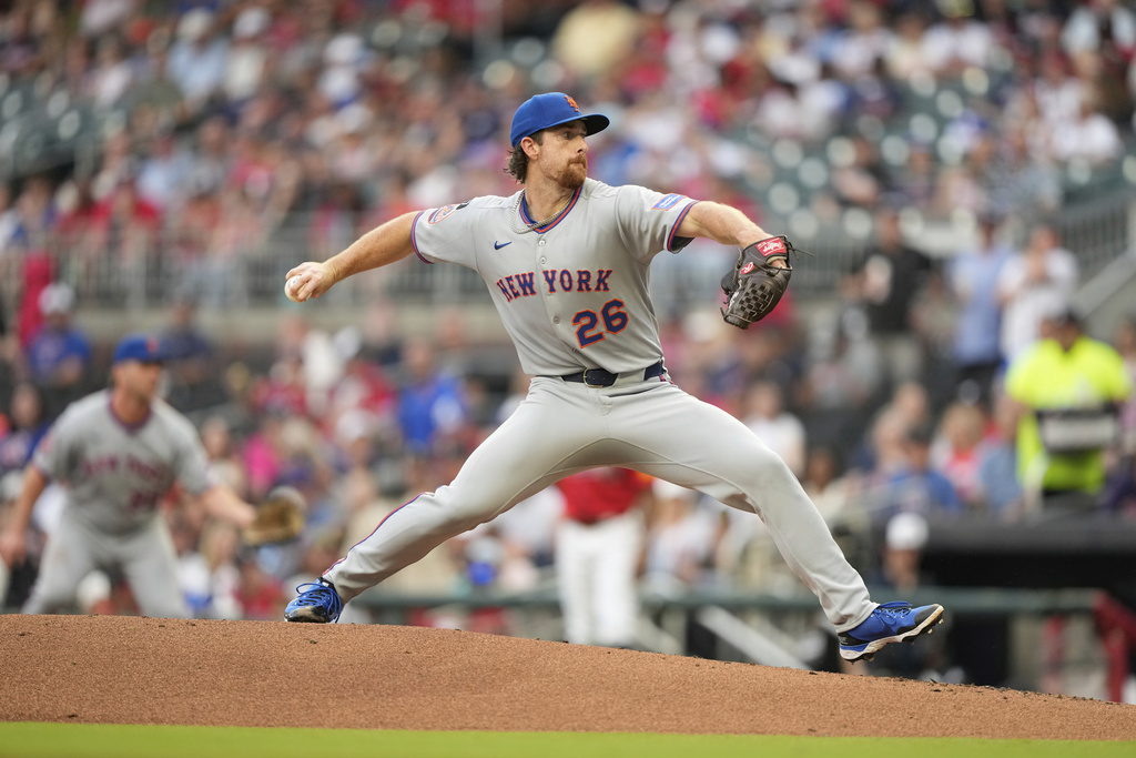 New York Mets pitcher Nolan McLean (26) delivers in the first inning of a baseball game against the Atlanta Braves, Friday, Aug. 22, 2025, in Atlanta. (AP Photo/Brynn Anderson)
