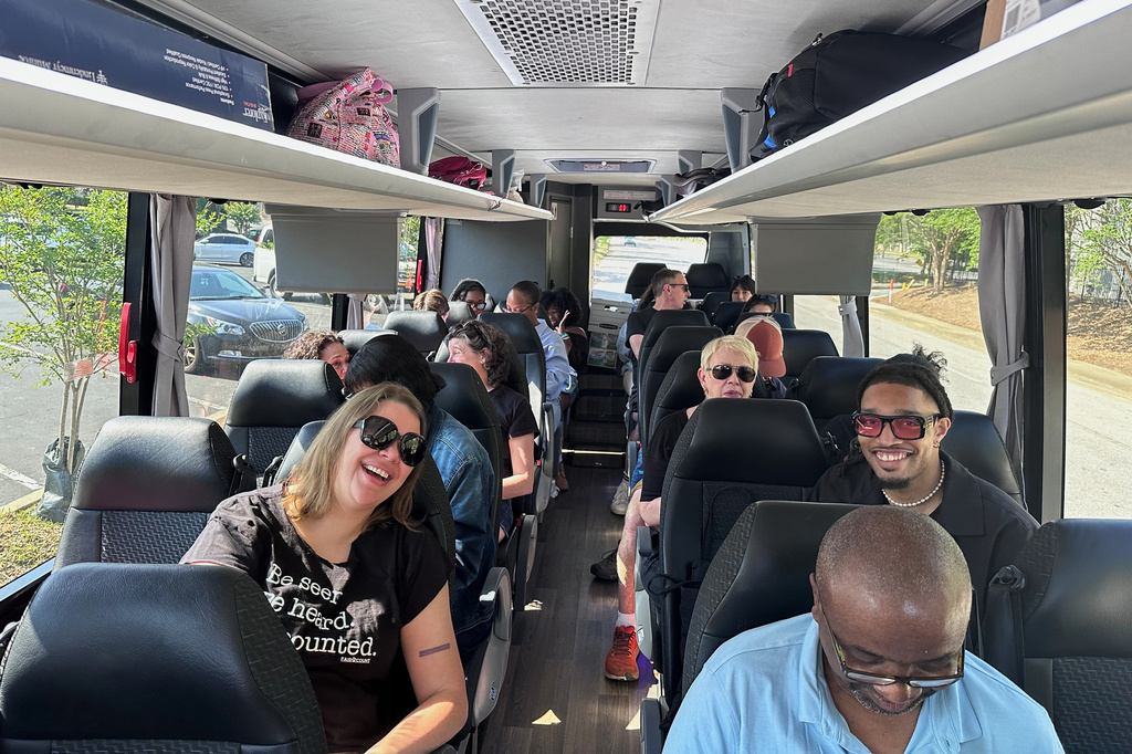 Voting rights and democracy activists ride together from Atlanta to Montgomery, Ala., on Saturday, May 16, 2026, for a rally against efforts by Republican legislative majorities to reduce Black representation in Congress from Southern states. (AP Photo/Bill Barrow)