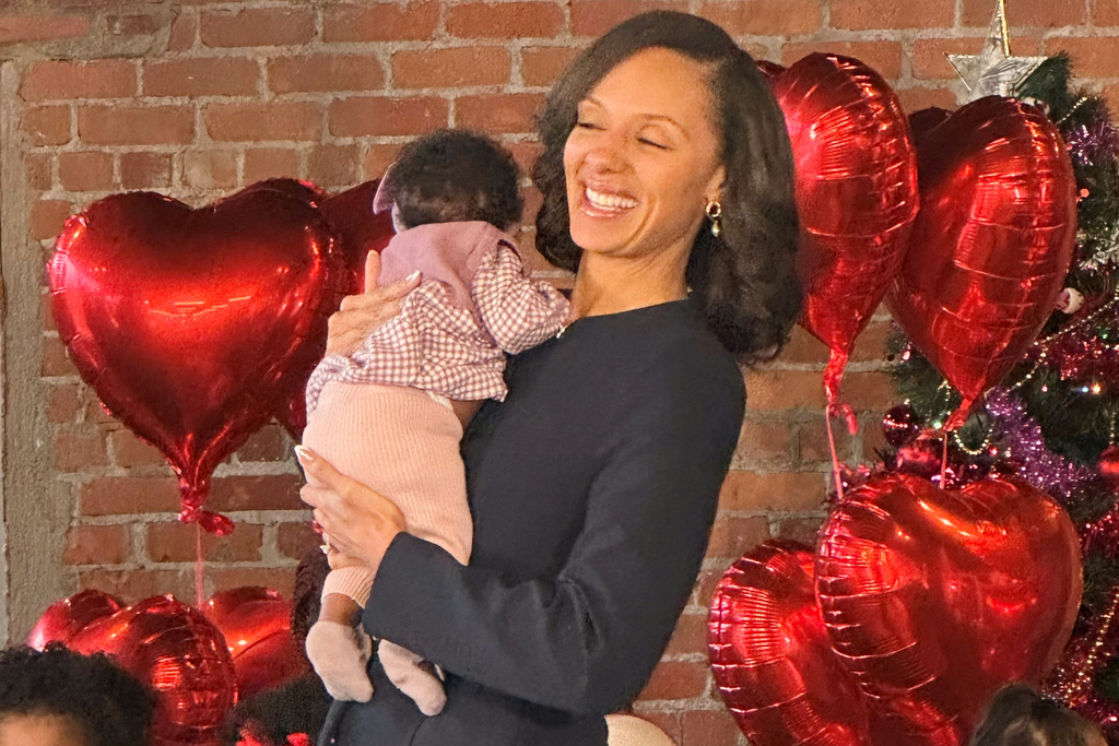 Detroit Mayor Mary Sheffield holds child during an announcement of the city's participation in Rx Kids program that provides cash to help expectant mothers, Monday, Jan. 5, 2025, in Detroit. (AP Photo/Corey Williams)